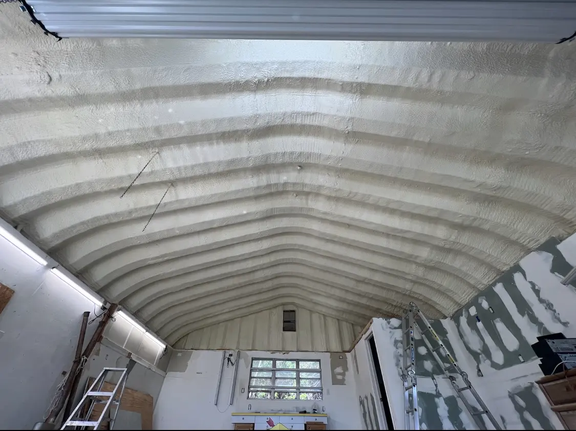 Spray polyurethane foam applied to the underside of a metal roof deck in Ripley